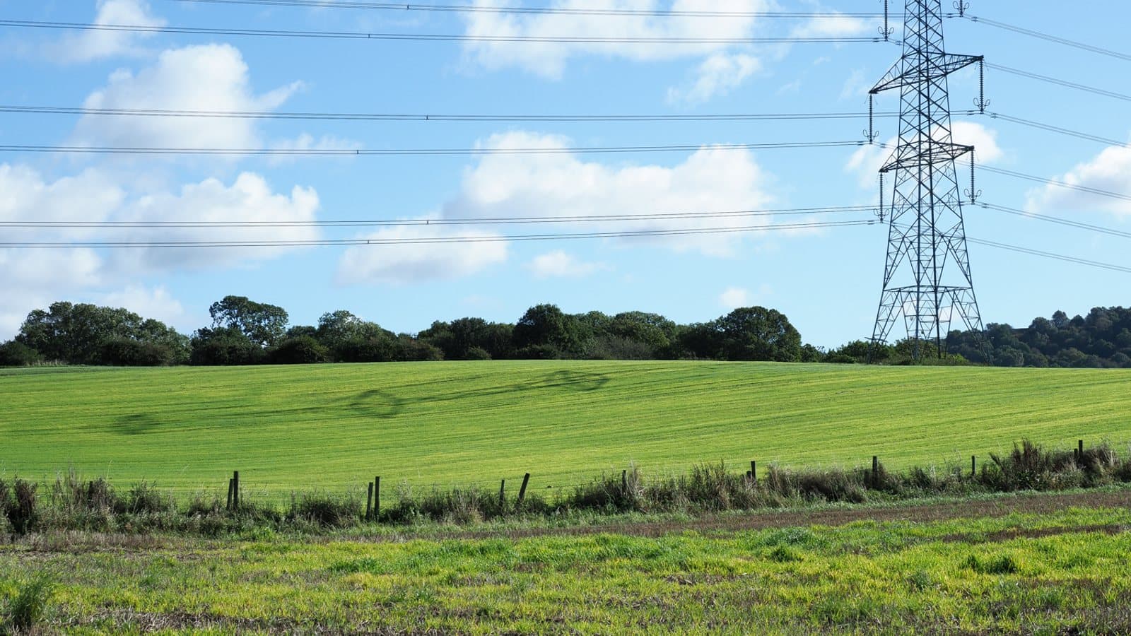 Electricity transmission pylon and its shadow geograph.org.uk. File photograph.
