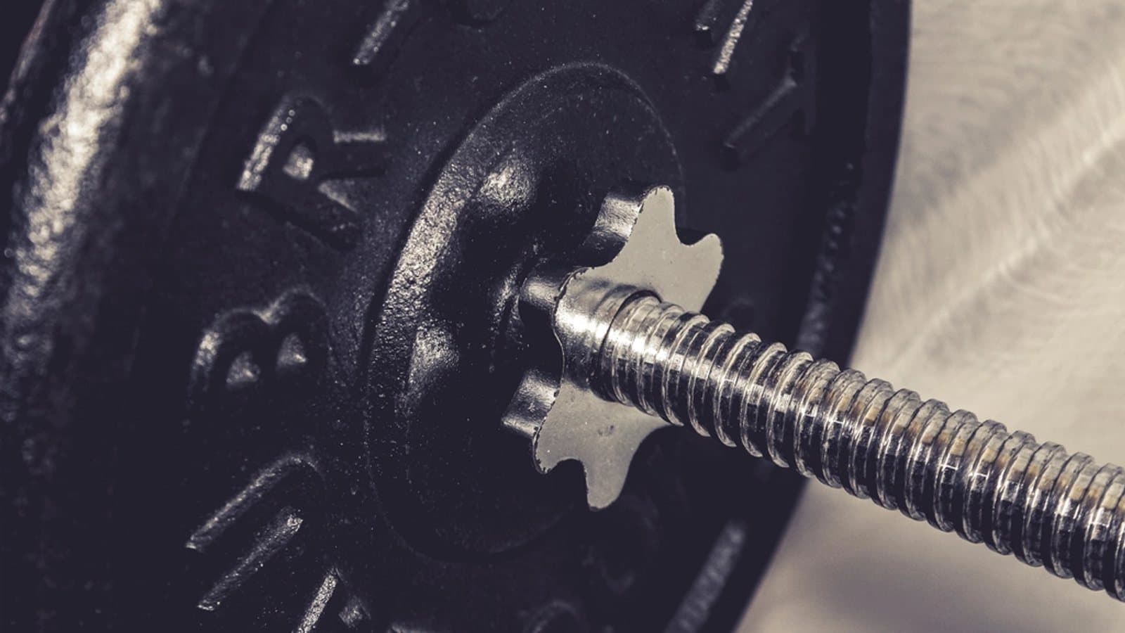 Closeup weight plate bar. File photograph.
