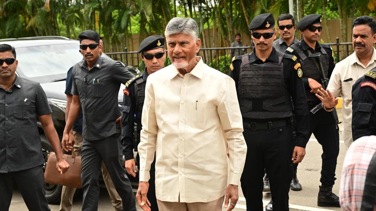 Andhra Pradesh Chief Minister N. Chandrababu Naidu arrives flanked by a security detail